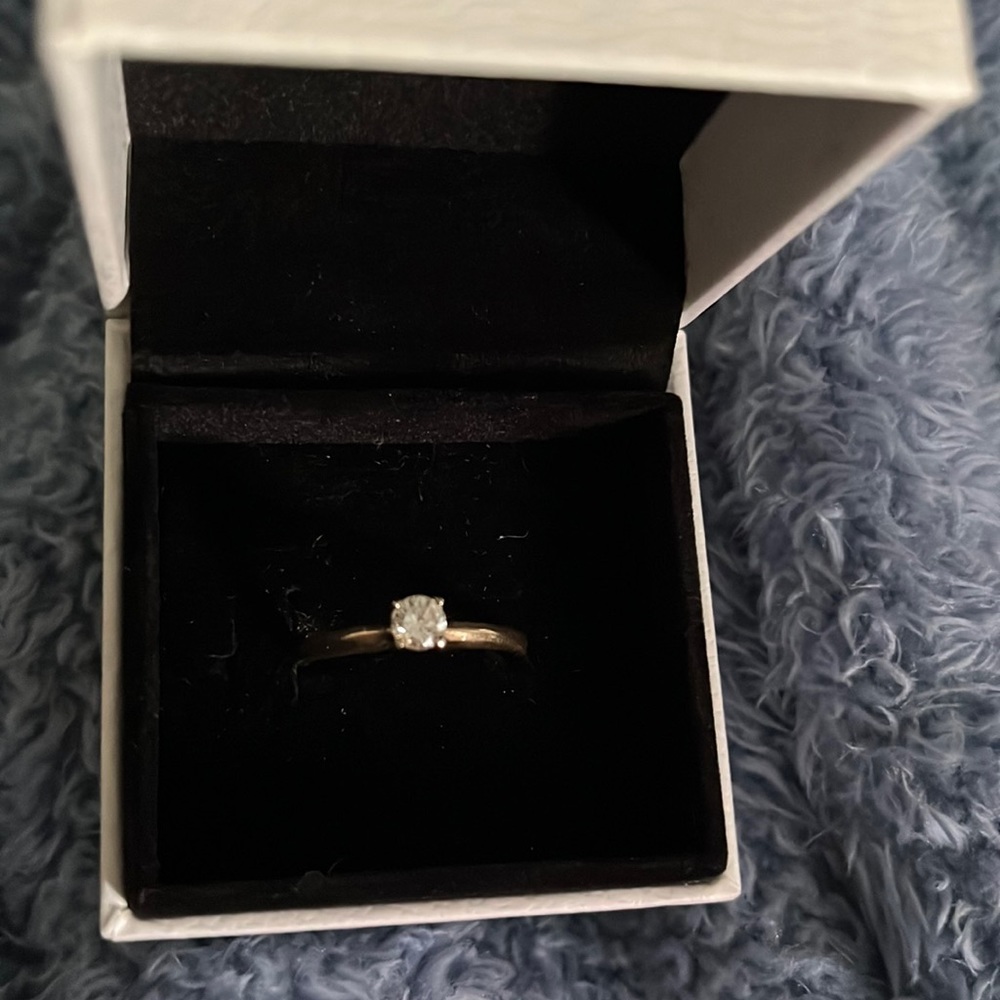Princess cut .20 ct engagement ring.  Stamped 14k